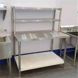 A stainless steel working table with shelves
